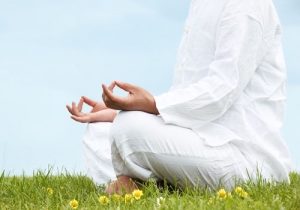 Man sitting in meditative lotus position