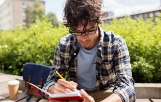 Young man journaling: Creative Writing in the Metaphysical Field