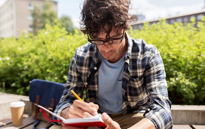 Young man journaling: Creative Writing in the Metaphysical Field